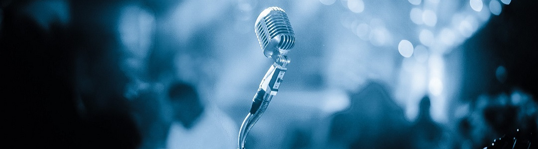 Image with a microphone representing previous edition of the festival